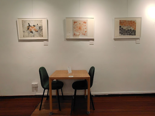 Four of Zimbiri's paintings turned into prints are currently on display there
