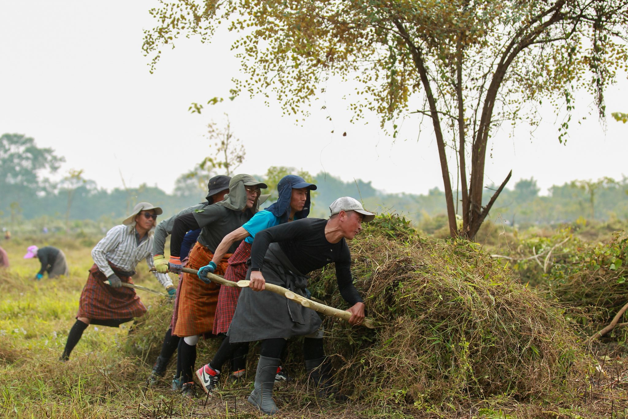 bhutanese locals building gelephu mindfulness city in unity
