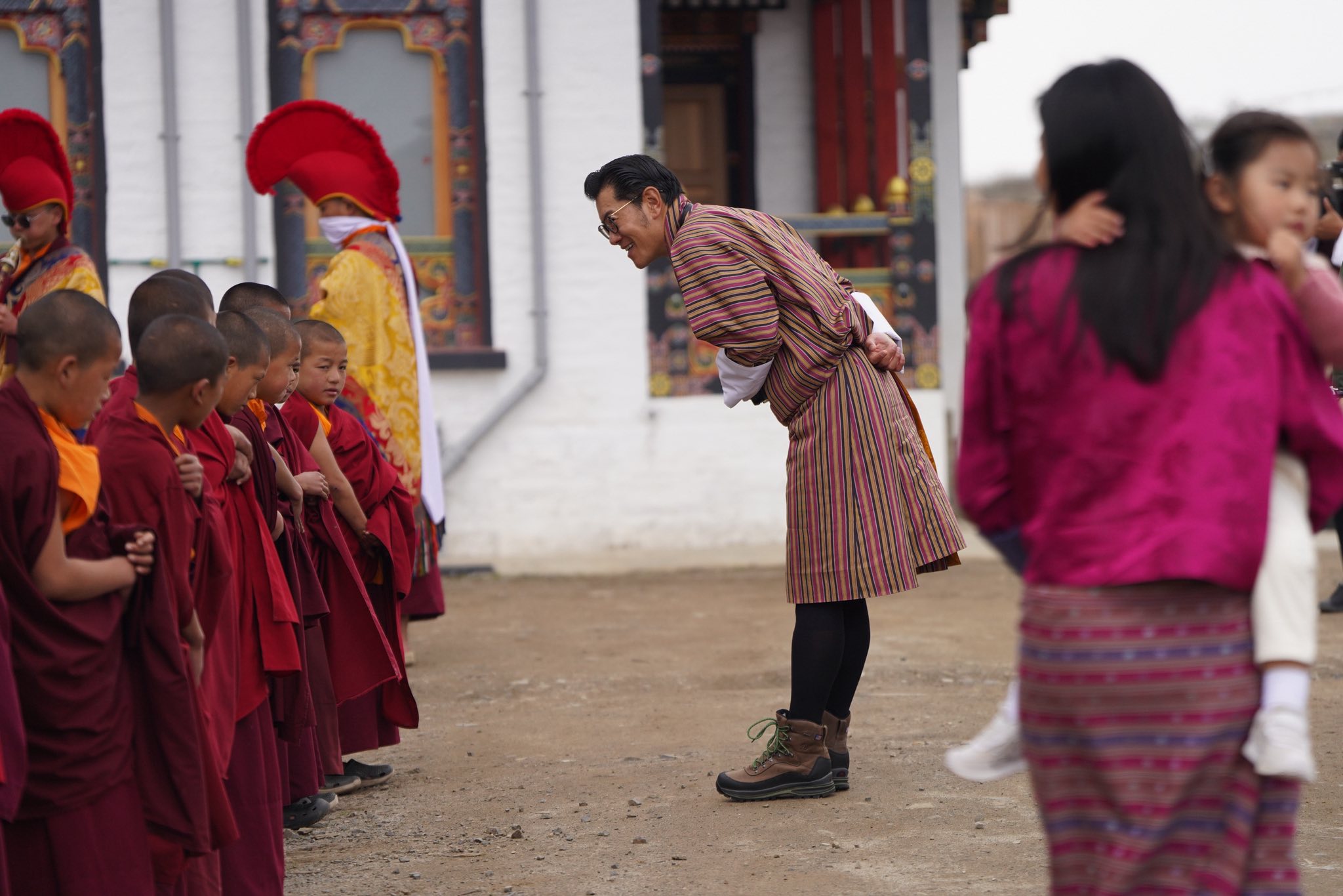 his majesty and little monks in eastern bhutan