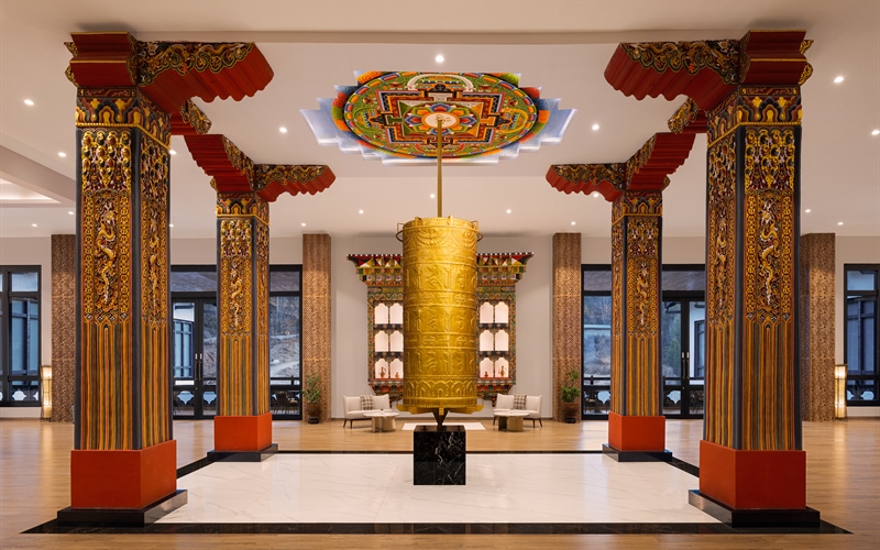 dawa at the hilltop by heeton prayer wheel at the entrance