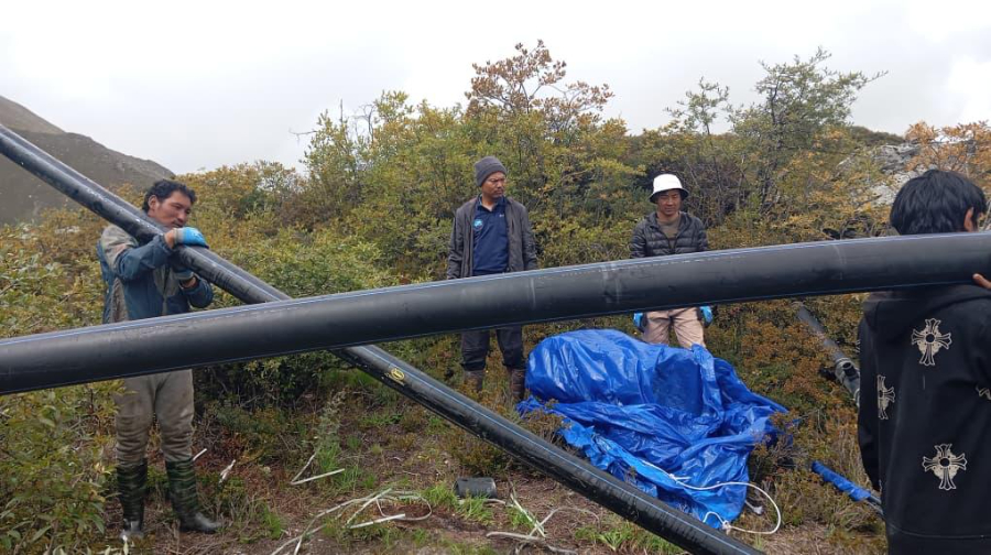team conducting siphon test for bhutan glacial lakes