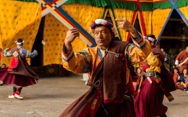 What are the zhey dances in Bhutan?